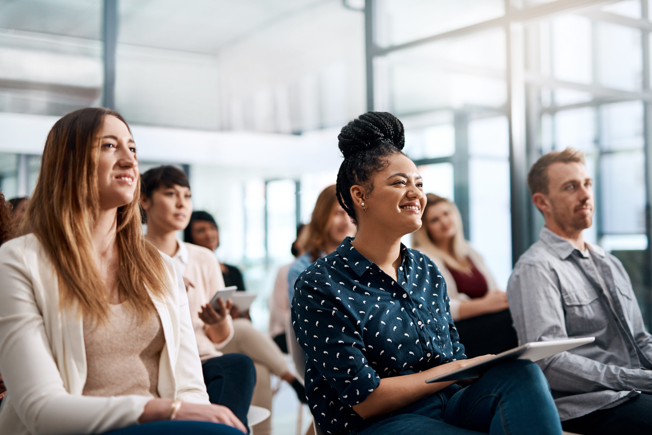 Shot of a group of businesspeople attending a conference