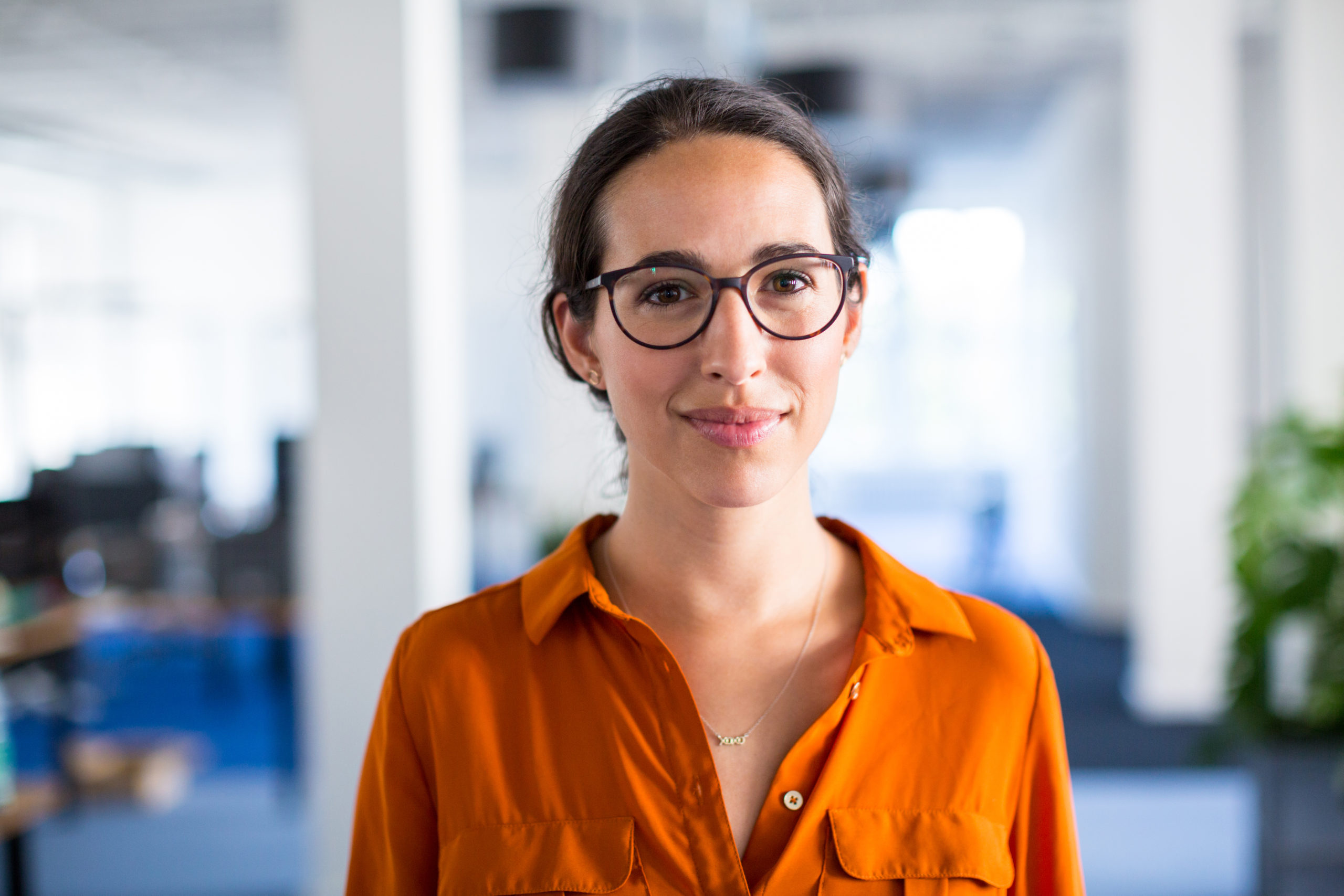 Young businesswoman with eyeglasses in office