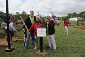 Rob Flaherty, Ketchum CEO, and David Gallagher, CEO of Ketchum Europe, with the mayor of La Conception in front of the plaque to Parc Ketchum.