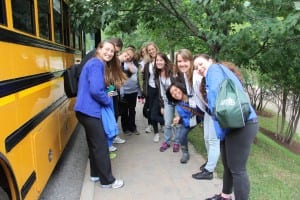 Campers gather outside the buses to head to their community service project in the town of La Conception.