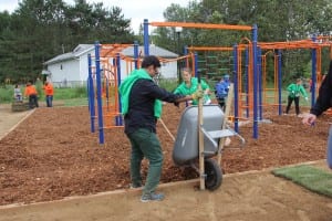 Campers tackle the difficult task of laying the mulch.