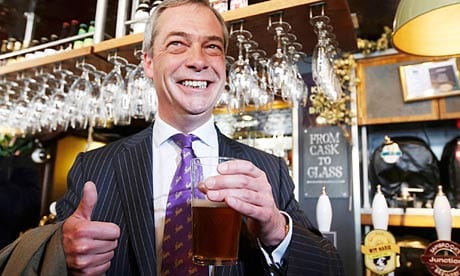 Ukip leader Nigel Farage with a pint of beer in a pub