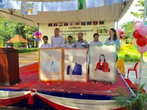 Portraits drawn by students were presented to Room to Read founders (from left): John Wood, Dinesh Shrestha and Erin Ganju.