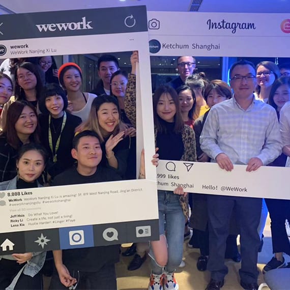 A group of female and male colleagues from Ketchum China posing in an Instagram frame