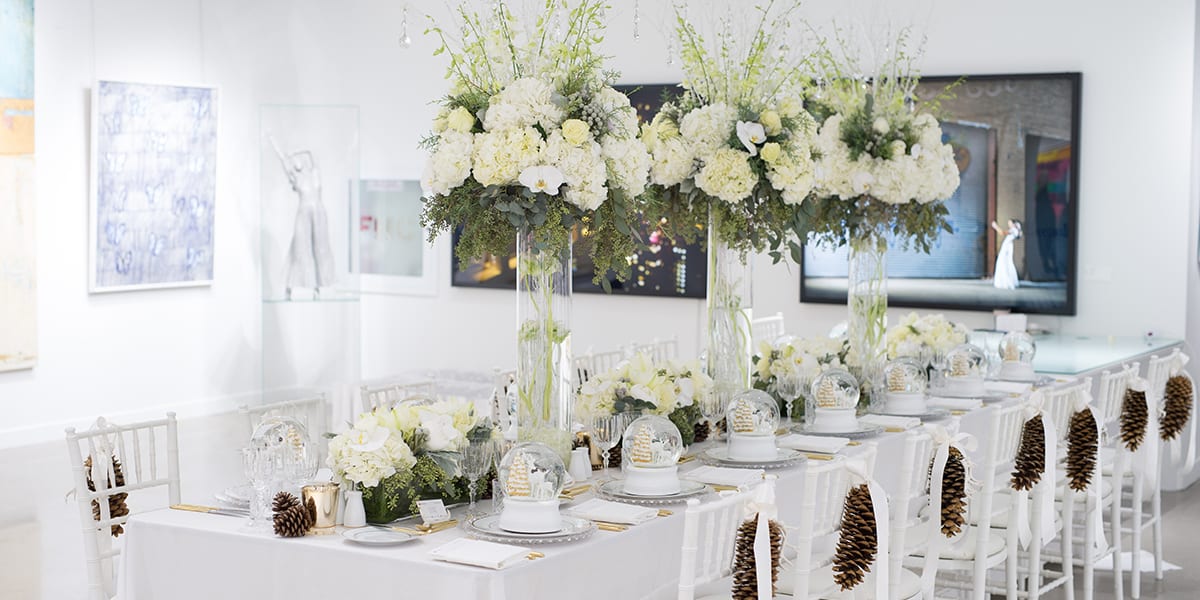 white flowers and white themed dining table
