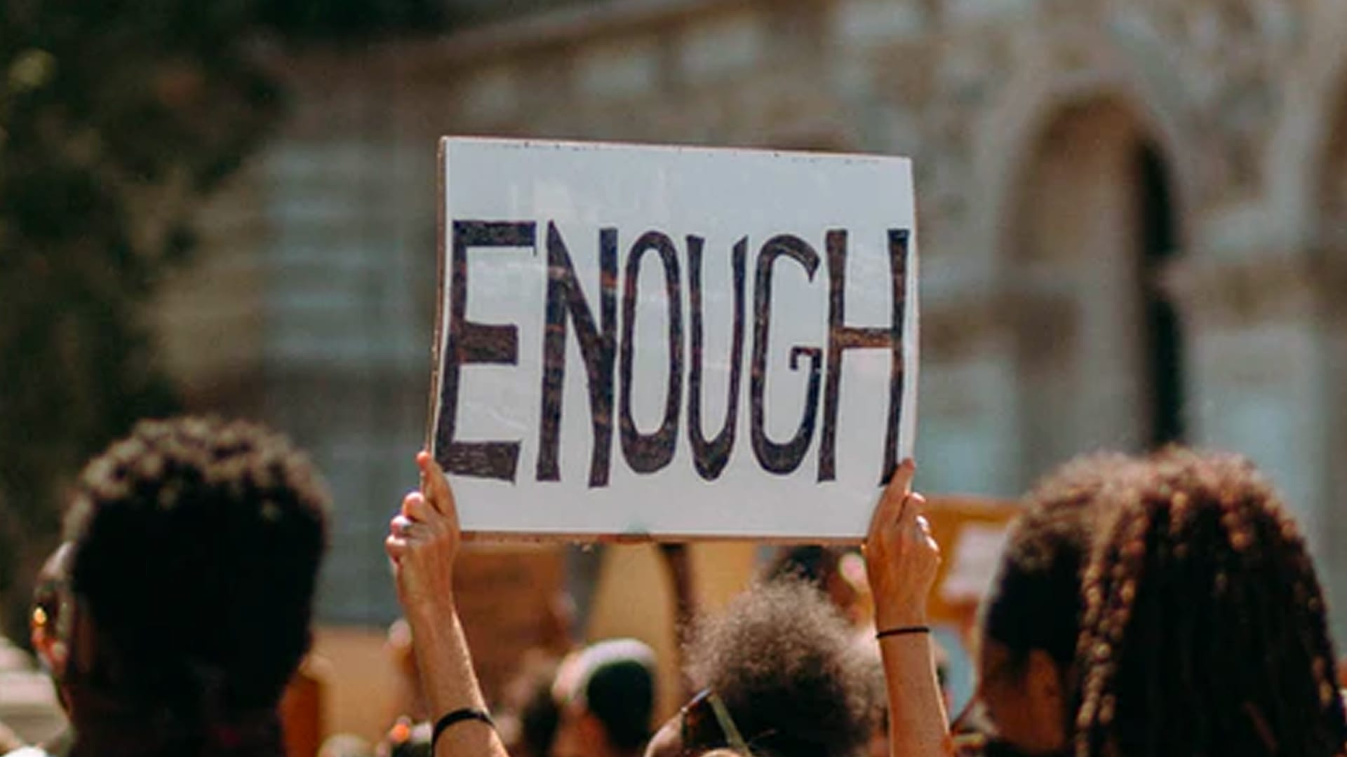 (K)No(w) Limits, Part 2 – Do You Know What Your Brand Stands for_ - Protestor Holds Up Sign Reading "Enough"