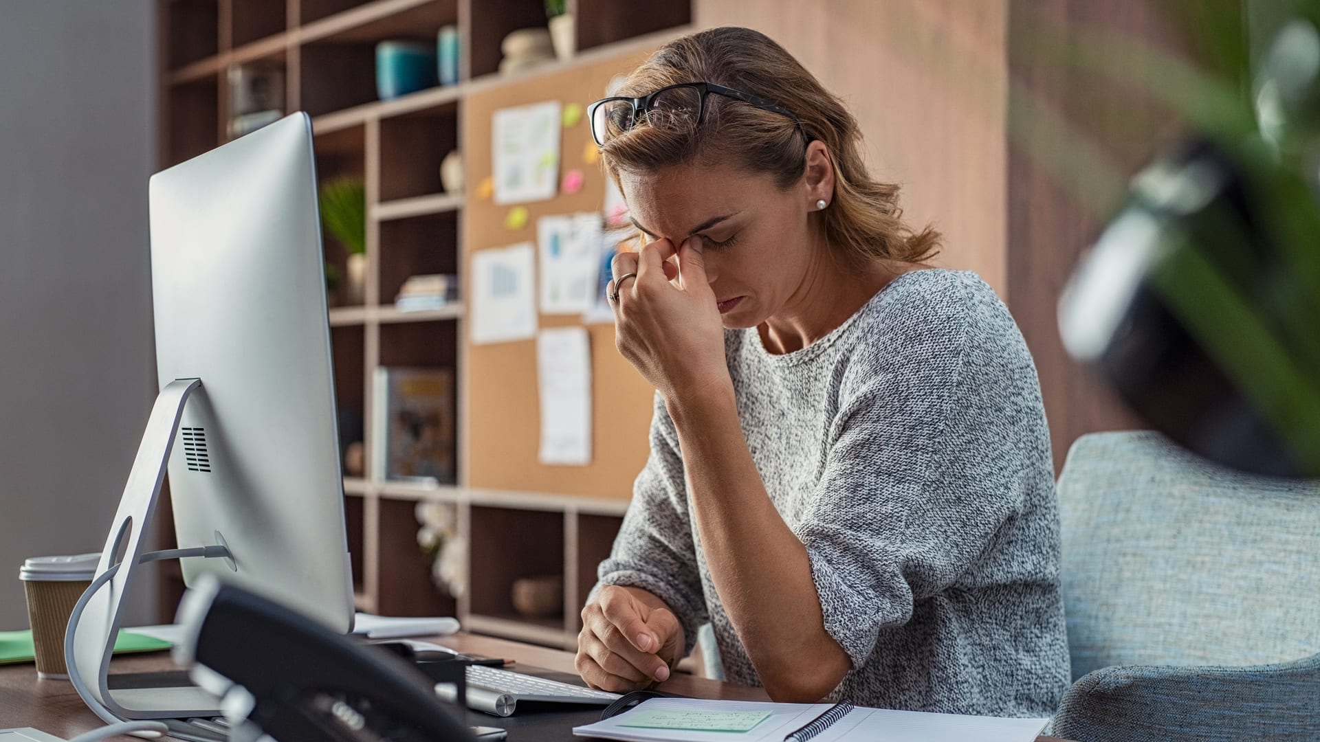Addressing COVID Burnout in Financial and Professional Services - Woman experiencing stress at work