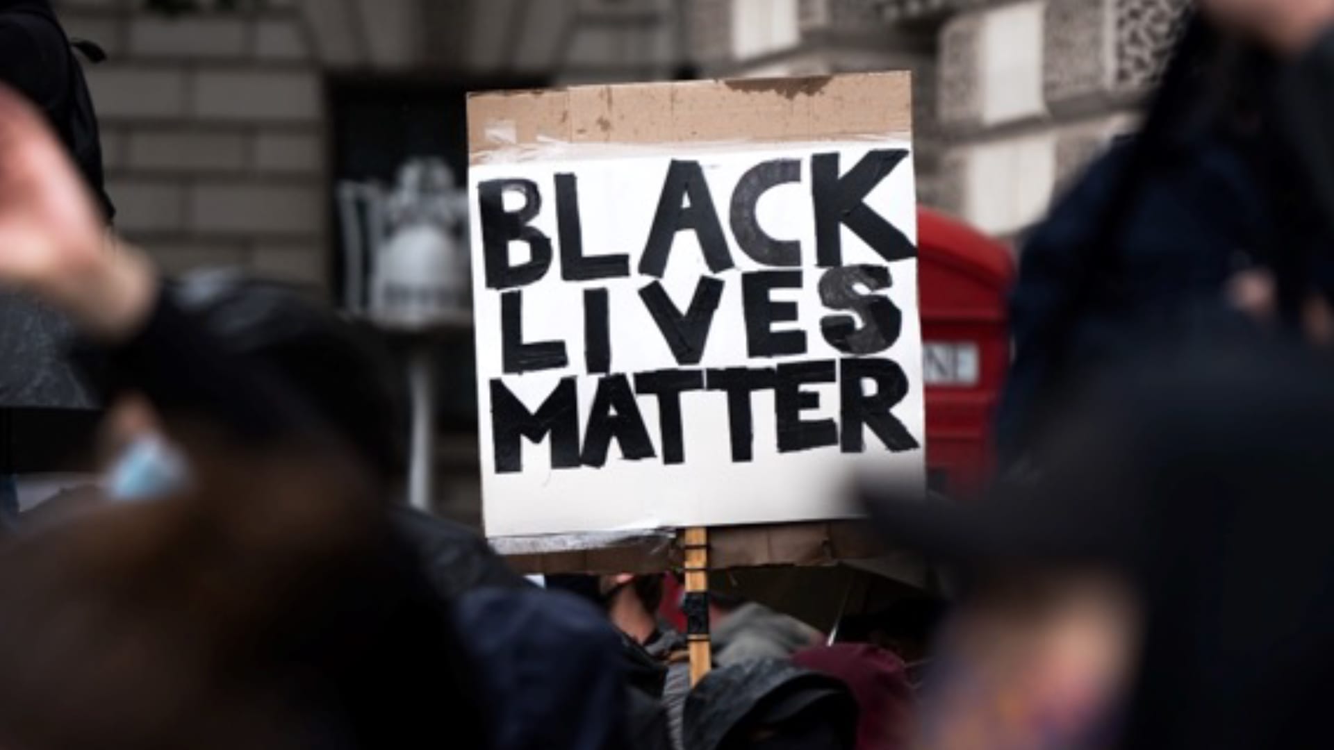 George Floyd, One Year Later- Key Communications Considerations (Black Lives Matter protest sign)