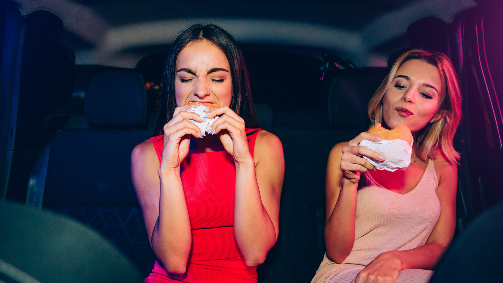 The Hollywood Effect on Plant-Based Food Brands - photo of two young celebrities eating burgers in the back of a limo