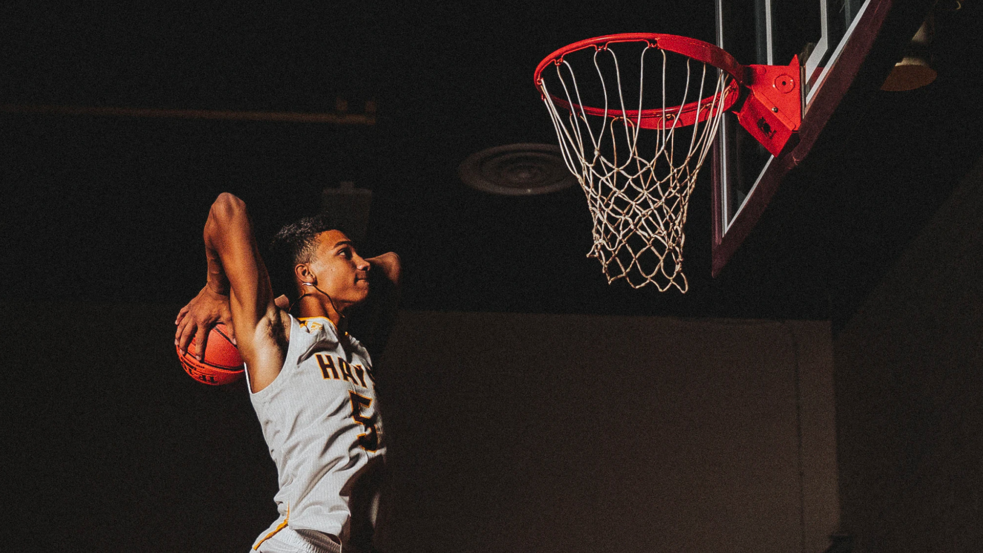 The Big 3 in College Sports- Name, Image, Likeness (NIL) - photo of young basketball player about to dunk